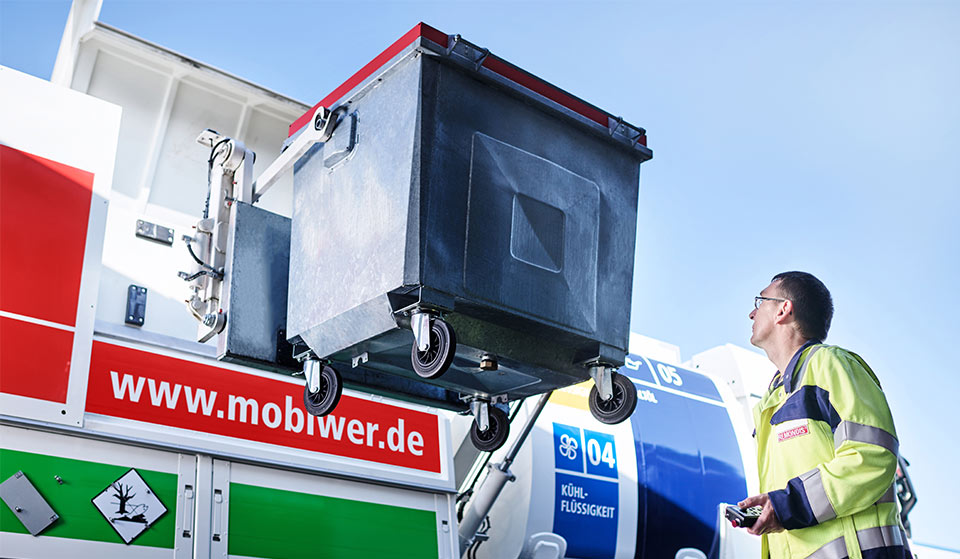 Staff member operating the MOBIWER during workshop waste collection.